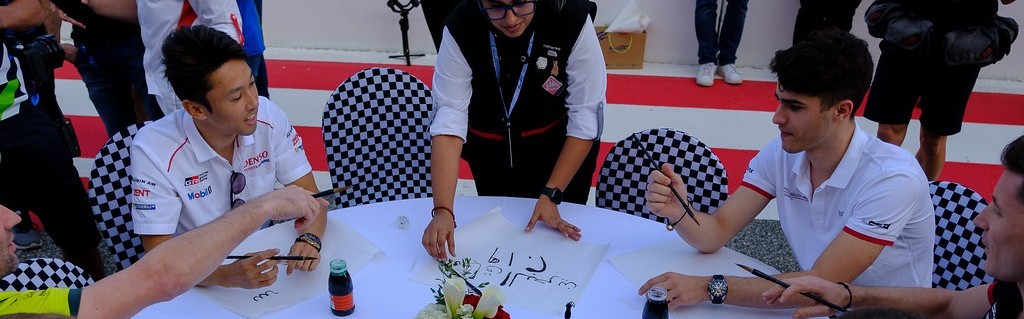 WEC drivers try their skills at Arabic calligraphy!