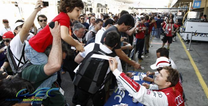 The pit lane teeming with people for the autograph session