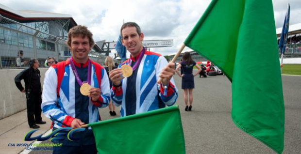 Olympic heroes wave green flag